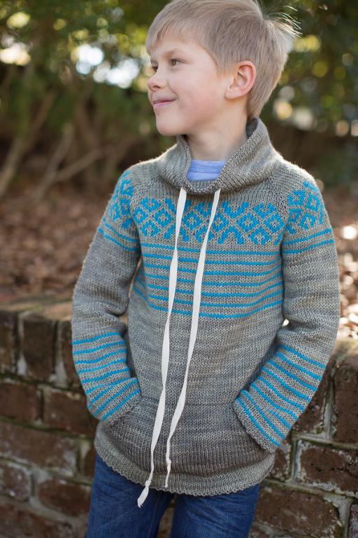 Knit kangaroo sweater with raglan sleeves and geometric pattern