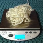 Cream colored mystery yarn on a digital scale